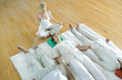 Photo: Alternative therapy session, three adults lying side by side while therapist sits nearby Alternative therapy session, three adults lying side by side while therapist sits nearby