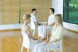 Two pairs of adults sitting together during therapy session