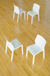 Two pairs of chairs on hardwood floor, high angle view