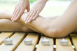 Woman receiving leg massage