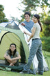 Young campers setting up tent
