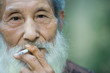Elderly man smoking cigarette