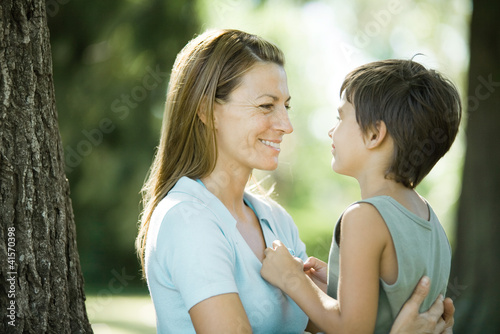 Photo: Mother and son outdoors, face to face Mother and son outdoors, face to face