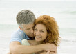 Couple embracing on beach