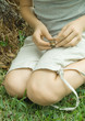 Child holding toad on lap