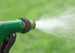 Water spraying from garden hose