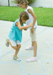 Girls playing hopscotch