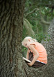 Girl in tree reading