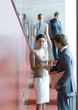 Businessman and woman exchanging business card