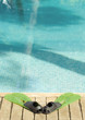 Flippers by edge of pool
