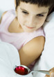 Child being fed spoonful of medicine