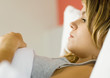 Young woman lying in bed
