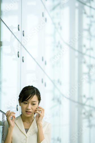 Photo: Businesswoman using cell phone Businesswoman using cell phone