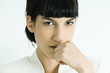 Woman, hand in front of mouth, portrait