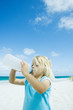 Child drinking water on beach