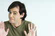 Man, raising eyebrows, holding up palms, portrait