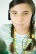 Girl with popped chewing gum bubble on lips, portrait