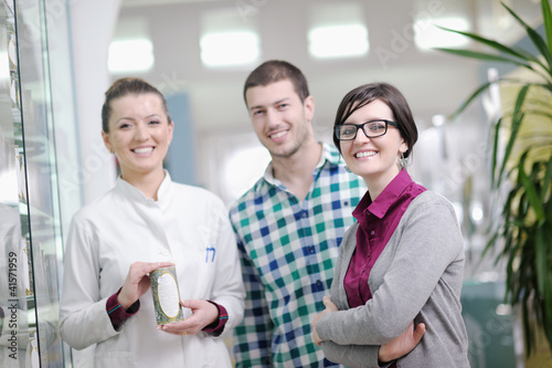 Photo: pharmacist suggesting medical drug in pharmacy drugstore pharmacist suggesting medical drug in pharmacy drugstore