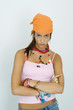 Photo: Teenage girl staring at camera, arms folded, head down, portrait Teenage girl staring at camera, arms folded, head down, portrait