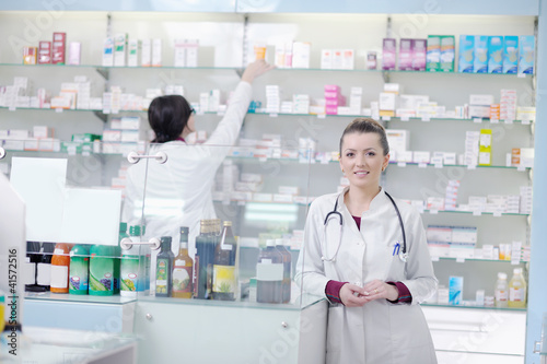 Photo: team of pharmacist chemist woman in pharmacy drugstore team of pharmacist chemist woman in pharmacy drugstore