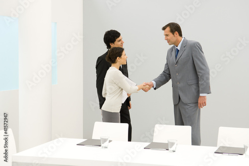 Photo: Business associates shaking hands Business associates shaking hands