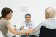 Multi-generational family listening to doctor