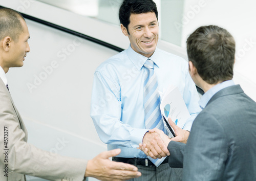 Photo: Businessmen being introduced Businessmen being introduced