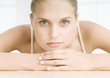 Young woman resting head on hands
