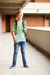 happy male high school student in school building