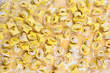 Tortellini italian pasta stuffed meat with flour on wooden backg Tortellini italian pasta stuffed meat with flour on wooden backg
