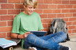 teen boy using tablet computer in school