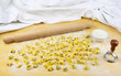 Tortellini italian pasta stuffed with flour and rolling pin Tortellini italian pasta stuffed with flour and rolling pin