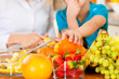 Mother and child with lots of fruits