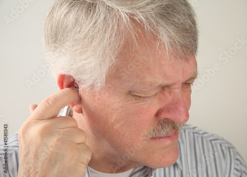 Photo: ear pain in a senior man ear pain in a senior man