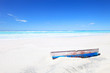 Old boat on white tropical sunny beach and a blue sky Old boat on white tropical sunny beach and a blue sky