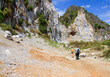 Two persons watching around on a mountain
