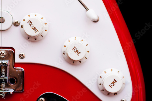 Photo: Vintage electric guitar volume and tune dials Vintage electric guitar volume and tune dials