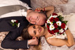 Happy bride and groom lying Happy bride and groom lying