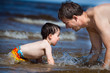 Happy father and his son at the seaside