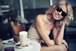 Cute blond beauty wearing sunglasses
