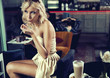 Blond beauty eating a cake