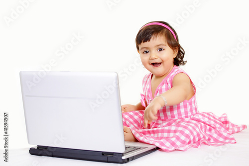 Photo: Computer generation baby playing with laptop Computer generation baby playing with laptop