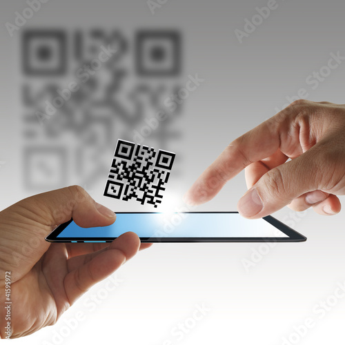 Photo: hand and tablet computer scan Qr code hand and tablet computer scan Qr code