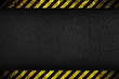 Dark background with yellow caution stripes Dark background with yellow caution stripes