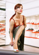 Foto: woman trying on shoes woman trying on shoes