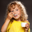 Little girl eating yogurt Little girl eating yogurt