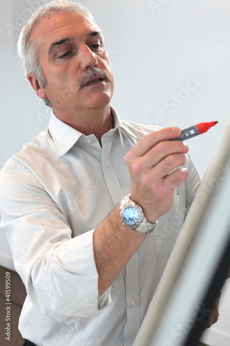 Photo: teacher making a presentation teacher making a presentation