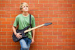 teen boy with guitar daydreaming teen boy with guitar daydreaming