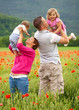 Family in poppy field