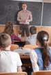 Young teacher in front of class